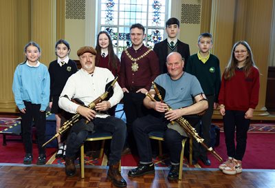 School pupils and Lord Mayor Councillor Ryan Murphy at an event in City Hall to celebrate Seachtain na Gaeilge