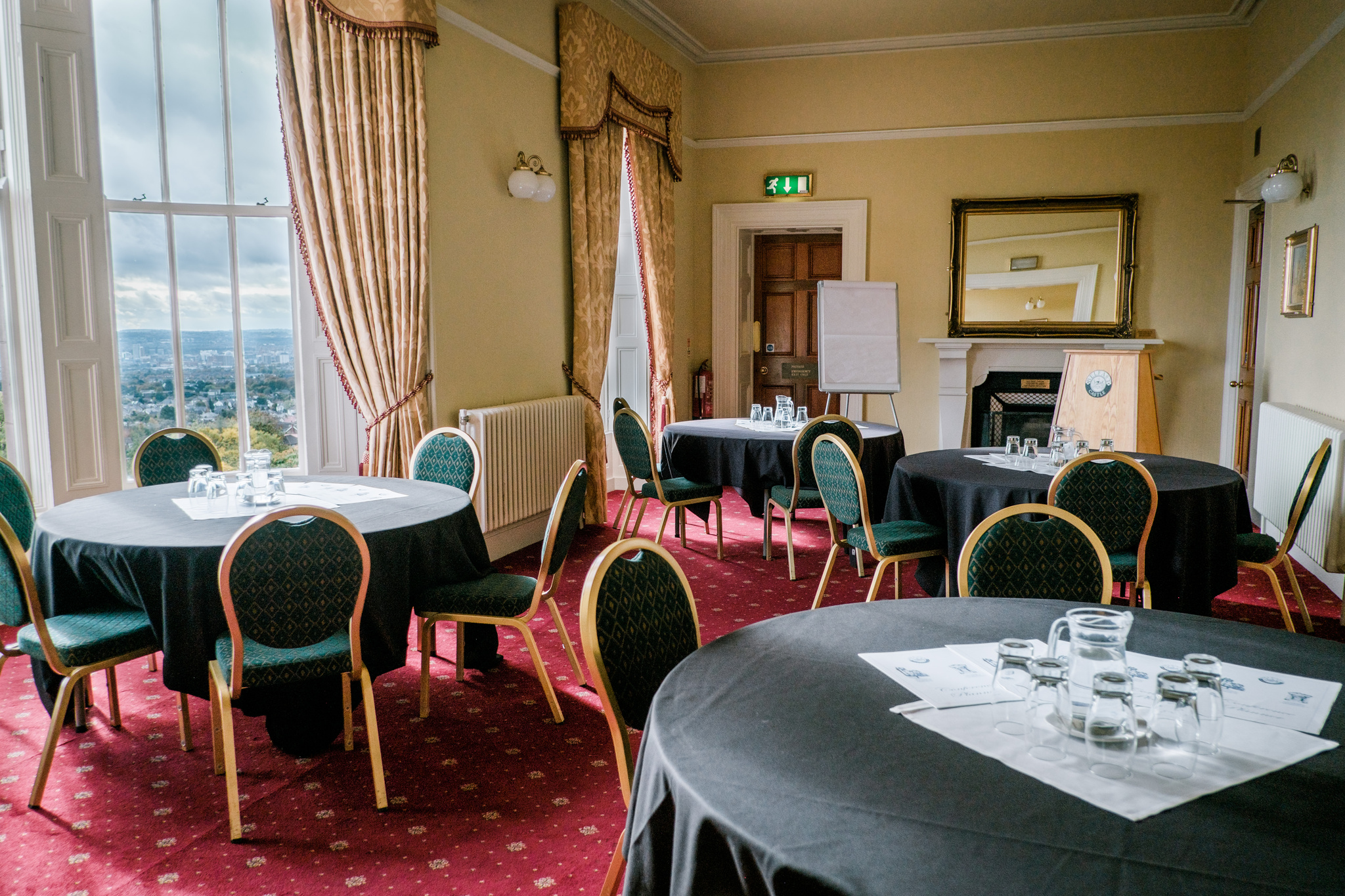 Ben Madigan Room with tables and chairs in a cabaret style setup..