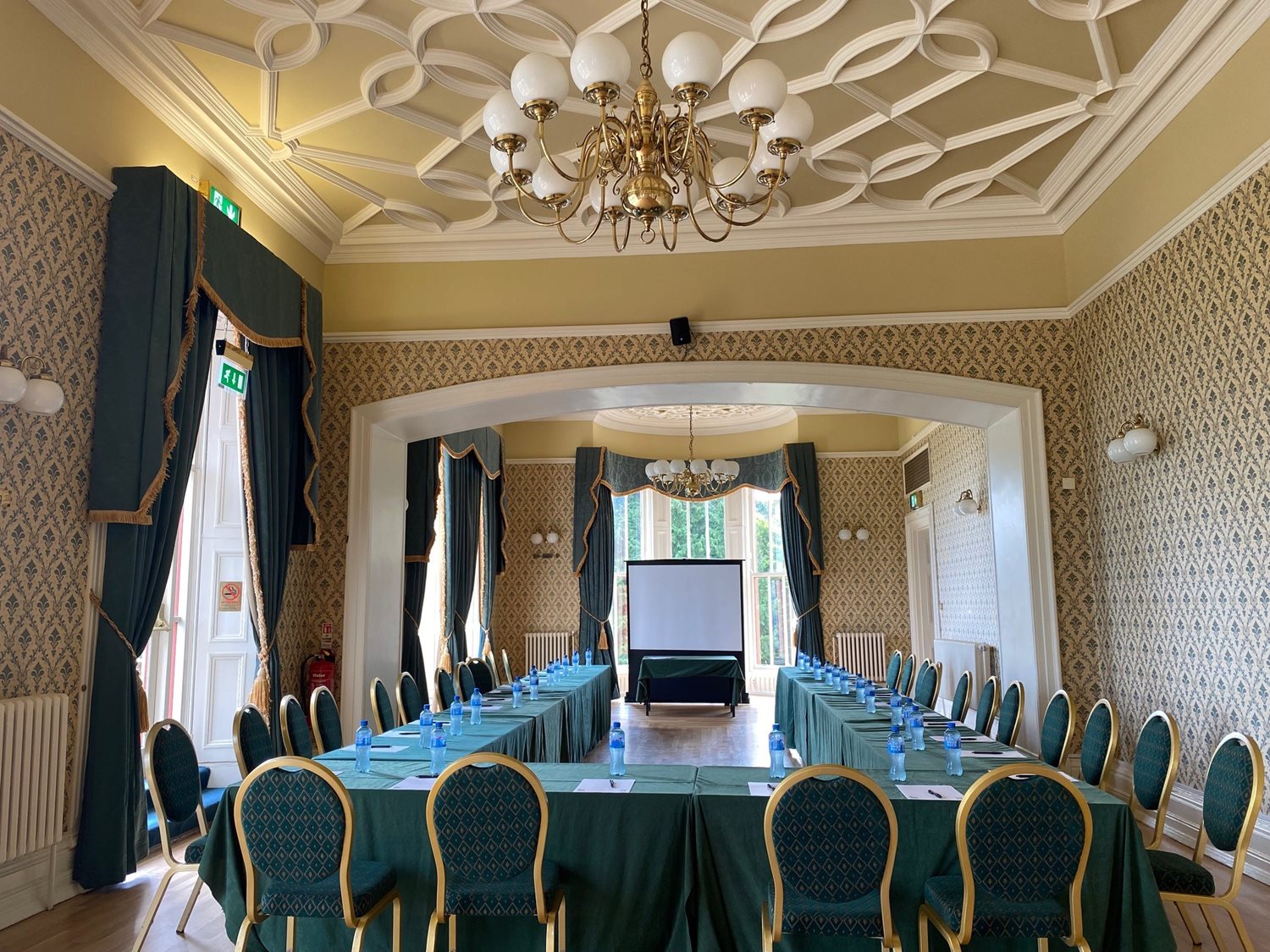Chichester Room with a table and chairs in a u-shape setup.